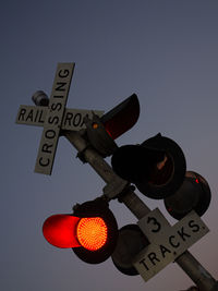 Railroad crossing with red light