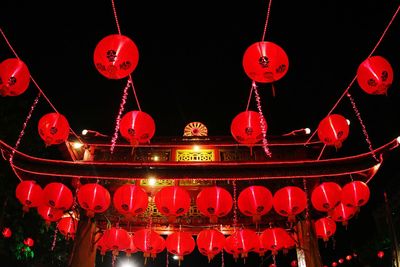 Low angle view of firework display at night