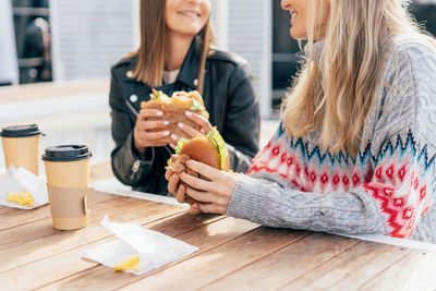 Smiling woman having food