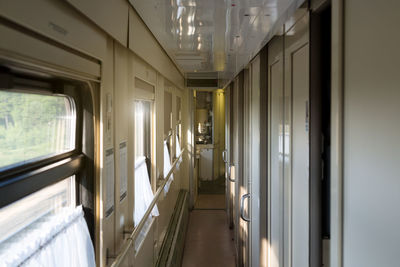 An empty corridor of a railway carriage compartment. the concept of long-distance travel.