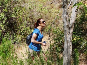 Young woman walking at forest