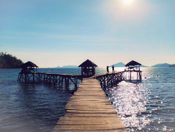 Pier over sea against sky