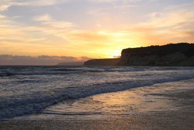 Scenic view of sea against sky during sunset