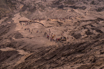 High angle view of people walking in desert