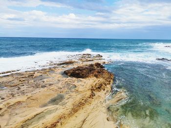 Scenic view of beach against sky