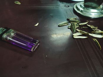 High angle view of illuminated equipment on table