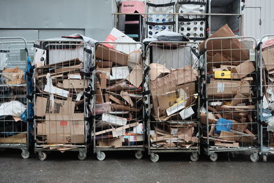 Stack of shopping cart on road in city