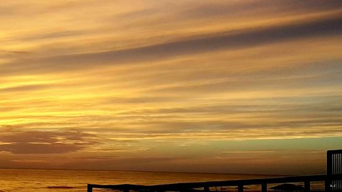 Scenic view of sea against sky at sunset