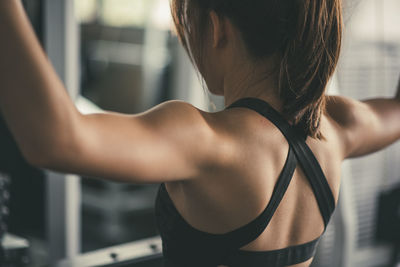 Young woman exercising in gym