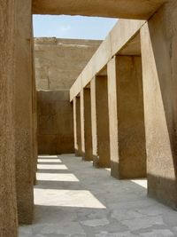 Corridor of historic building against sky