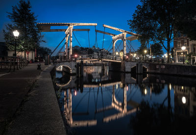 Reflection of illuminated buildings in water at night