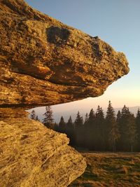 Rock formations on landscape against sky