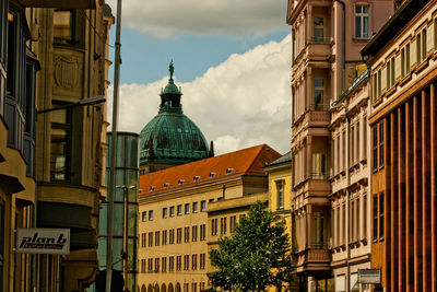 Buildings in city against sky