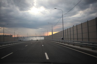 Highway against sky during sunset