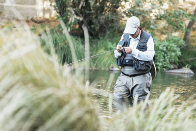 Man fishing in lake