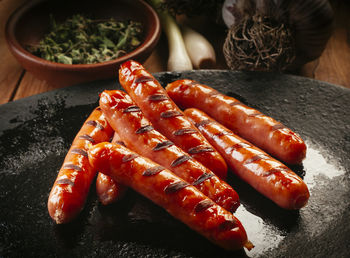 High angle view of meat on barbecue grill