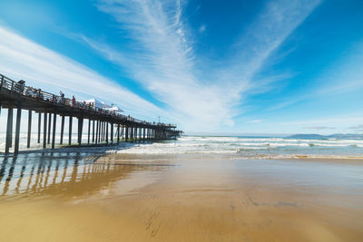 Pier over sea against sky