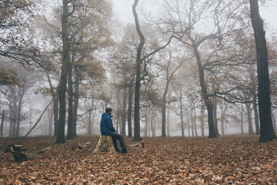 Full length of man and woman during autumn in forest