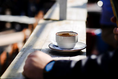 Close-up of coffee cup on table