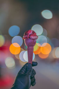 Close-up of hand holding ice cream