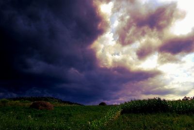 Scenic view of landscape against cloudy sky