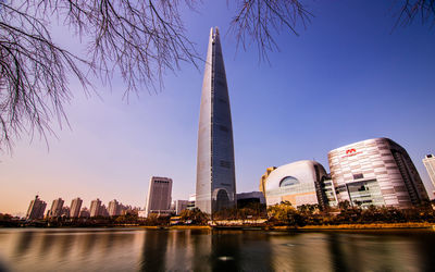 Modern buildings in city against clear sky