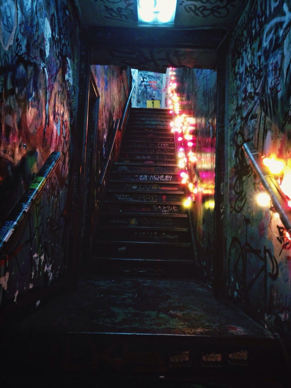 indoors, illuminated, steps, built structure, steps and staircases, architecture, staircase, abandoned, old, railing, night, house, wall - building feature, wood - material, the way forward, sunlight, interior, no people, lighting equipment, light - natural phenomenon