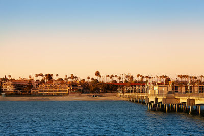 Panoramic view of sea and buildings against clear sky