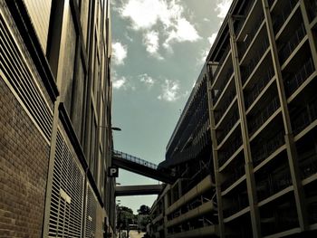 Low angle view of building against cloudy sky