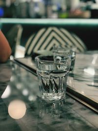 Close-up of glass of water on table
