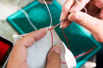 Close-up of hands sewing