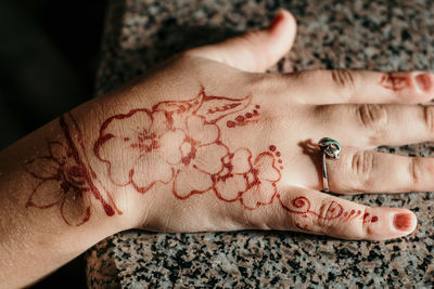 Close-up of girl hand with henna tattoo