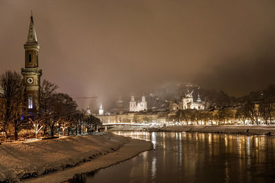 Illuminated buildings at waterfront