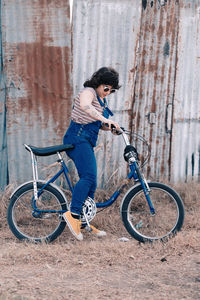 Portrait of woman riding a vintage bicycle