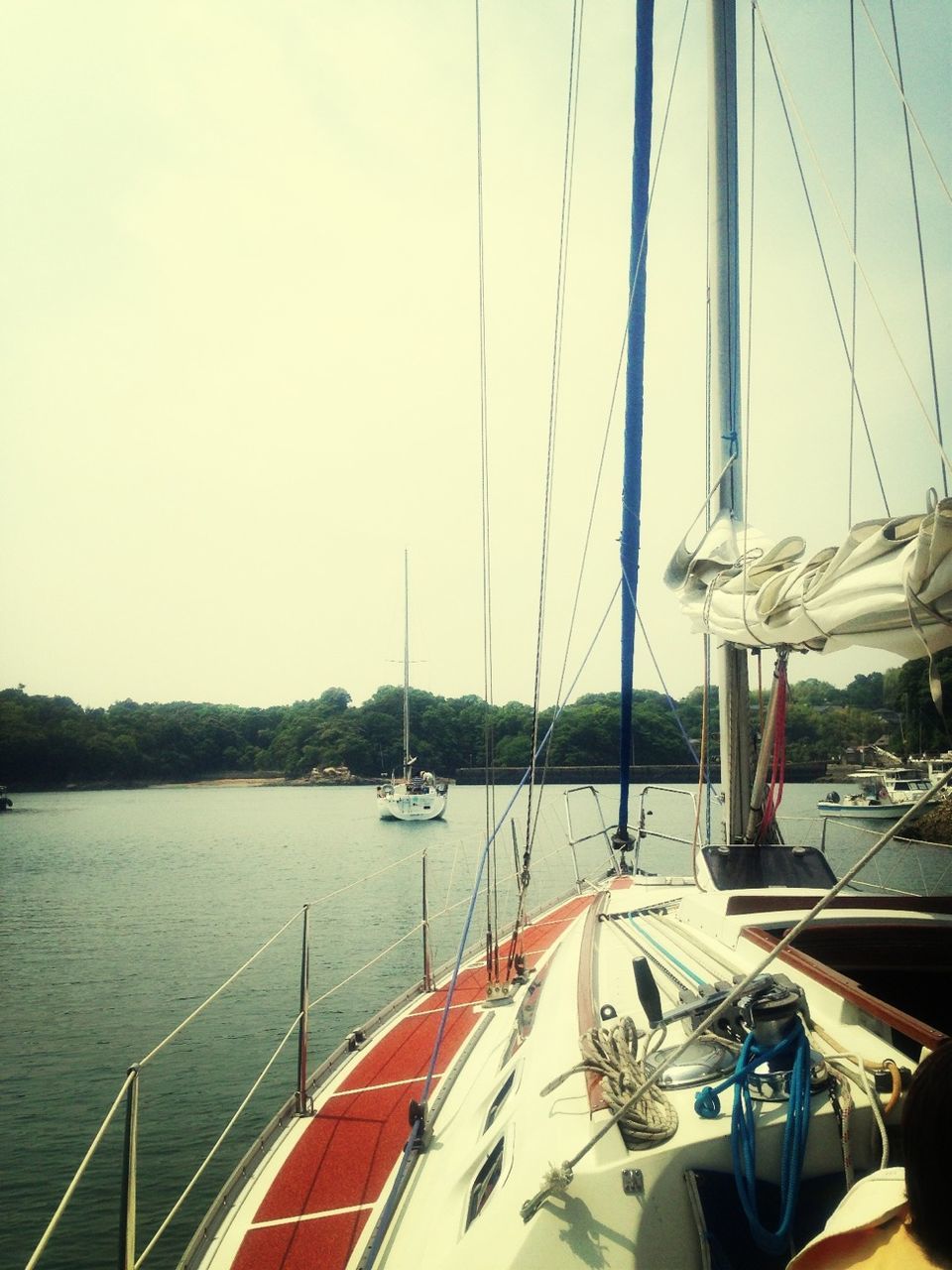 transportation, nautical vessel, mode of transport, boat, water, moored, sailboat, travel, part of, clear sky, mast, sailing, cropped, sea, sky, river, journey, nature, lake, day