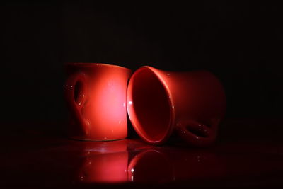 Close-up of wineglass against black background