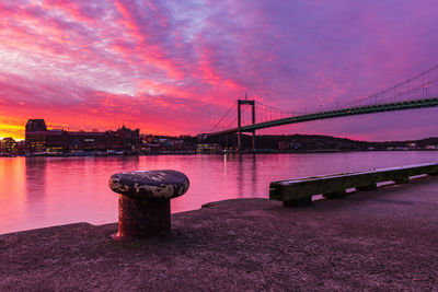 Dramatic sunrise over gothenburg, river and road bridge, gothenburg, sweden, europe