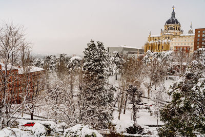 Buildings against sky during winter