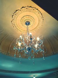 Low angle view of chandelier hanging from ceiling