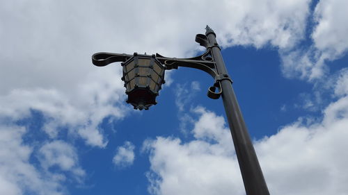 Low angle view of metallic lantern against sky at magic kingdom park
