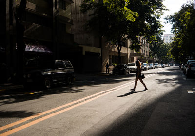 Man walking on street in city