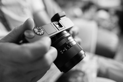 Close-up of hand holding camera