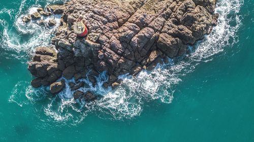 High angle view of rock formation in sea