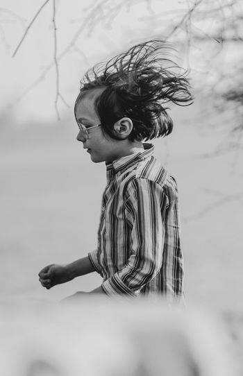Side view of boy with tousled hair