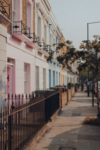 Street amidst buildings in city against sky