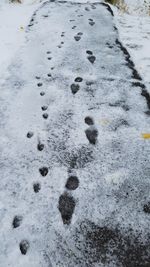 High angle view of footprints on snow