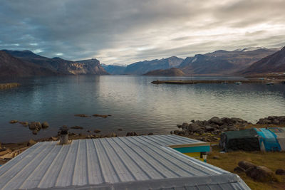 Scenic view of lake and mountains against sky