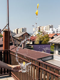 Buildings in city against clear sky