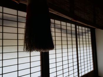 Low angle view of window in cage
