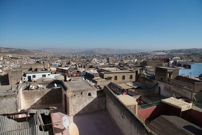 High angle view of townscape against clear blue sky